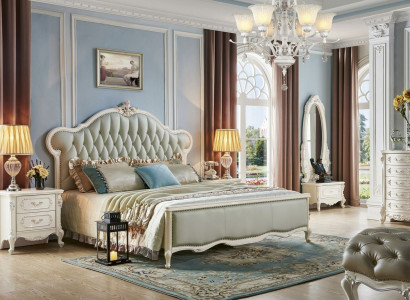 Elegant Chesterfield bed in classic style with matching bedside tables