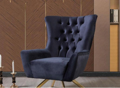 Luxurious blue Chesterfield armchair with velvet upholstery for the living room