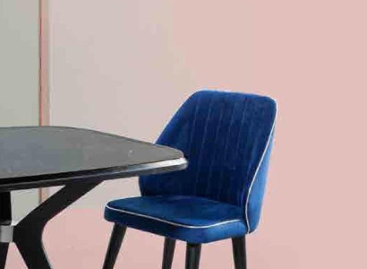 Blue upholstered chair with black wooden legs for dining room light model