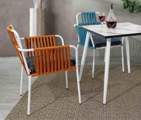 Original chairs light orange color on white stainless steel legs with soft cushions