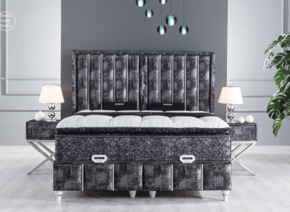 Black bed with mattress and two bedside tables in the bedroom furniture set