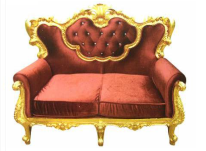 Chic 2-seater sofa with a bright color combination of elegant red and shiny gold tone in baroque style