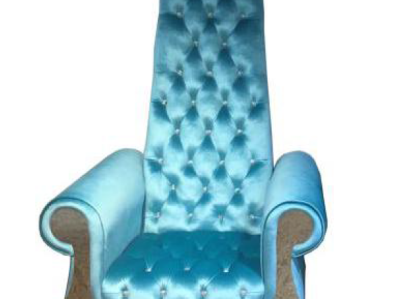 A sophisticated armchair with a high backrest and a design reminiscent of a Voltaire armchair