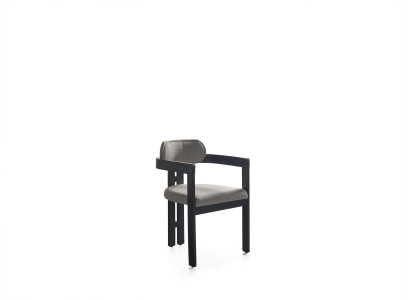 An ultra-modern chair with an unusual shape and interesting legs with a comfortable backrest in gray-black for the dining room