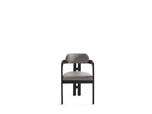 An ultra-modern chair with an unusual shape and interesting legs with a comfortable backrest in gray-black for the dining room