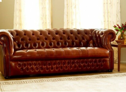Brown Chesterfield three-seater designer 3-seater sofa. Stylish couch