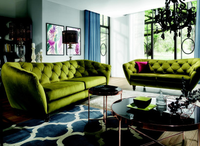 Three-seater sofa with luxurious Chesterfield backrest in an elegant shade of green